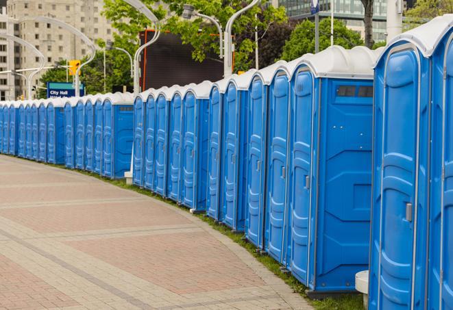 a row of portable restrooms set up for a large athletic event, allowing participants and spectators to easily take care of their needs in Alpharetta, GA